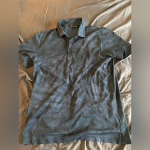 Men’s Travis Matthews golf polo.